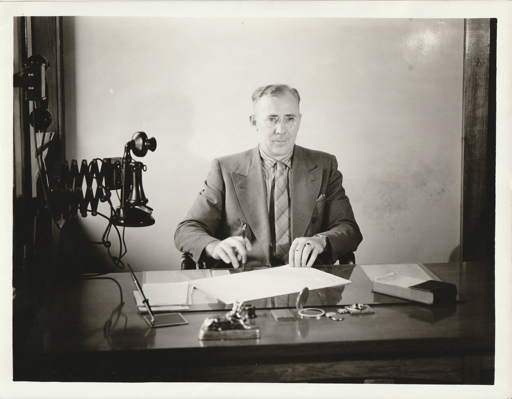 Man Signing Papers at Office Desk - Candlestick Telephone - Photo, c. 1930s