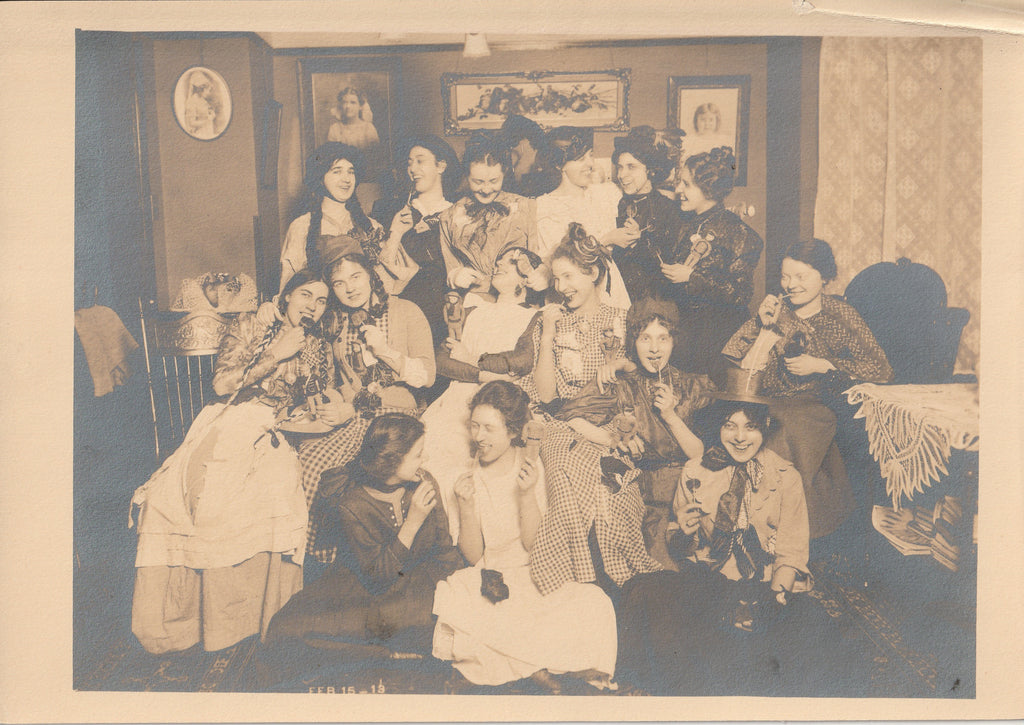 Valentine's Day 1913 - Soldier Dolls and Lollipops - Edwardian Girls - Antique Photo photograph from the Feb. 15, 1913. It shows an absolutely wonder group photo of a group of Edwardian teenage girls being silly and having fun celebrating Valentine's Day. They're all wearing splendid outfits, holding soldier dolls and licking lollipops. 