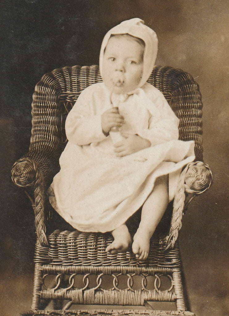 Baby Drinking From Murder Bottle - RPPC, c. 1900s