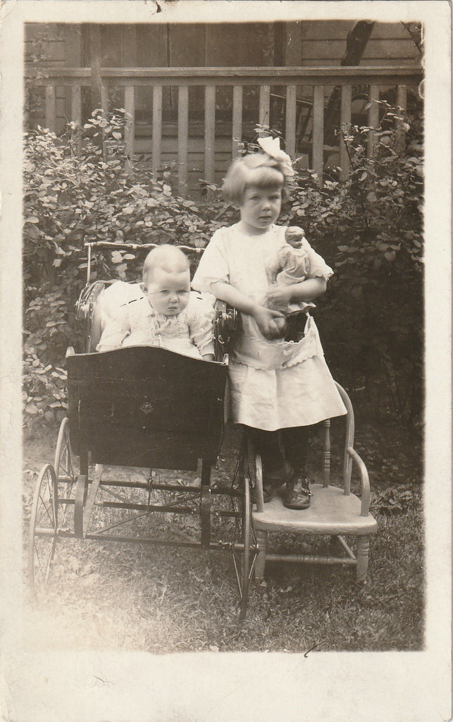 Louise, Hungry and Frightened - Girl with Doll - RPPC, c. 1910s