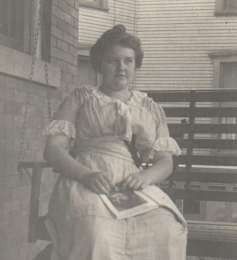 Edwardian Woman Reading Magazine on Porch Swing - RPPC, c. 1910s Close Up
