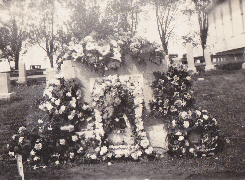 Flower Covered Headstone Close Up