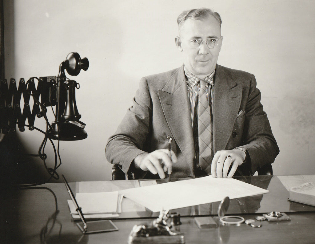 Man Signing Papers at Office Desk - Candlestick Telephone - Photo, c. 1930s Close Up
